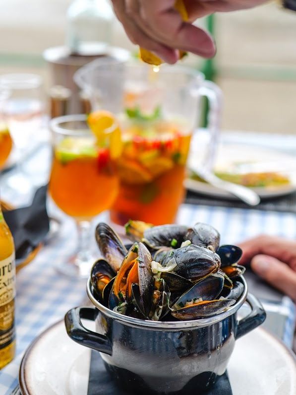 A pot of moules served at the Dockyard Restaurant, Marina Metro Hotel, on a table set on the seafront terrace
